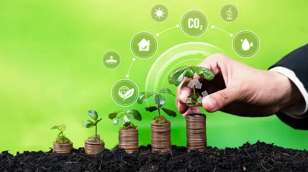 Stack of money growing with businessman investing in eco-friendly technology symbolize green business investment and economic financial sustainable growth on environmental sustainability. Reliance