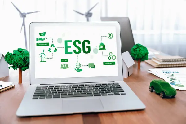 Green business company office with eco-friendly and environment conservation policy, office table with eco mockup and laptop display ESG as environmental social governance concept. Trailblazing