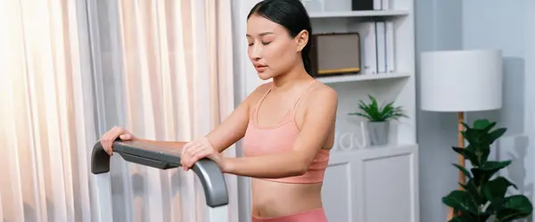 Energetic Strong Athletic Asian Woman Resting Elliptical Running Machine Home — Stock Photo, Image