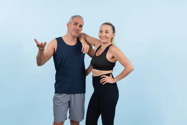 Active and fit physique senior people portrait with happy smile on isolated background. Healthy lifelong senior couple with fitness healthy and sporty body care lifestyle concept. Clout