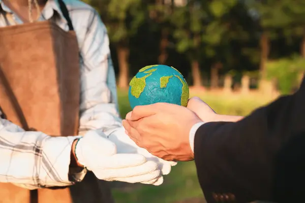 Eco-business company empower farmer with eco-friendly farming practice and clean agricultural technology. Cultivate sustainable future and holding Earth globe symbolize commitment to environment.Gyre