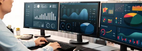Analyst working on data analysis or BI dashboard on computer monitor. Businessman analyzing financial data by Fintech in corporate office for business marketing and strategy planning. Trailblazing