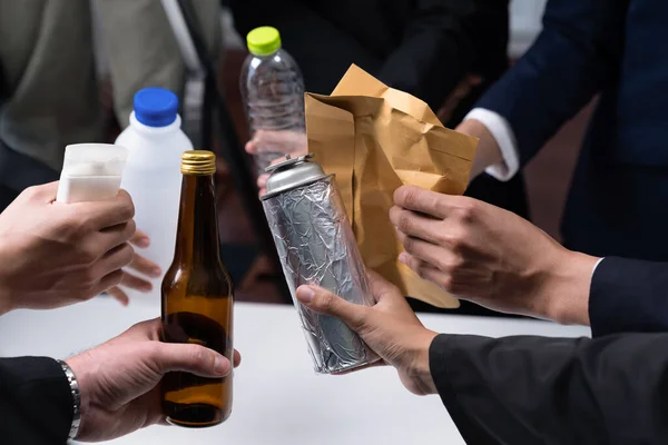 Business people holding garbage waste. Eco-business recycling waste policy in corporate responsibility. Reuse, reduce and recycle for sustainability environment. Quaint
