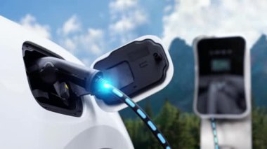 Çevre dostu EV araba şarj istasyonundan elektrik, akıllı dijital batarya durum hologramına sahip EV şarj cihazı. Doğada temiz enerji kullanan sürdürülebilir bir yolculuk. İnceleyin