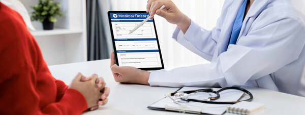 Laptop display medical report or diagnostic result of patient health on blurred background of doctors appointment in hospital. Medical consultation and healthcare treatment. Panorama Rigid