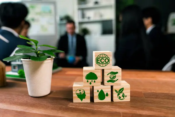 ECO symbol on wooden cube arranged for alternative clean energy utilization and implementation in business concept for greener sustainable Earth with corporate social responsibility policy. Quaint