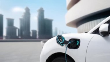 Elektrikli araba şarj istasyonuna bağlanıp şehrin arka planında akıllı dijital batarya durumu hologramıyla şarj edilecek. Geleceğin yenilikçi çevre dostu enerji sürdürülebilirliği. İnceleyin