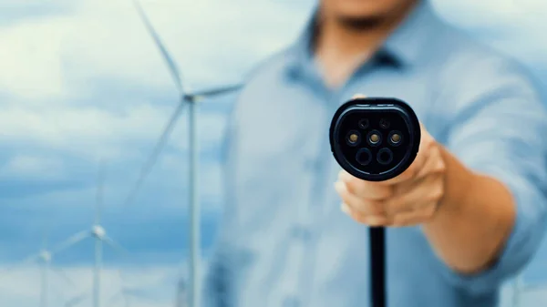 Focus Charger Pointing Front Camera Blurry Businessmans Hand Wind Turbine — Stock Photo, Image