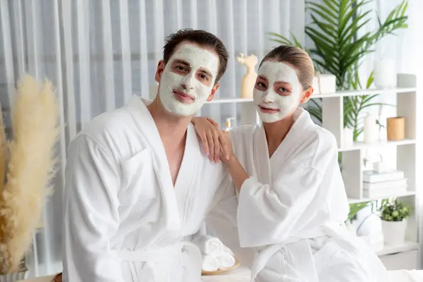 Blissful Couple Bathrobe Facial Cream Mask Enjoying Serene Ambiance Spa — Stock Photo, Image