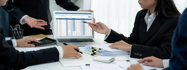 Corporate accountant team use accounting software on laptop to calculate and maximize tax refund and improve financial performance base on financial data. Modern business accounting . Shrewd