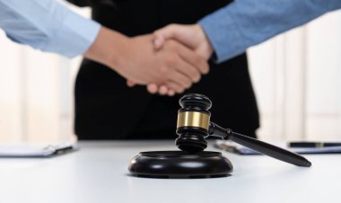 Lawyer acting as legal mediator successfully broke a compromise and seal with handshake between two parties to resolve business dispute through negotiation at law firm office. Panorama Rigid clipart