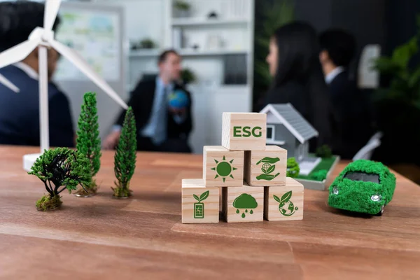 ESG symbol on wooden cube arranged for alternative clean energy utilization and implementation in business concept for greener sustainable Earth with corporate social responsibility policy. Quaint