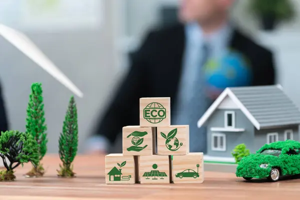ECO symbol on wooden cube arranged for alternative clean energy utilization and implementation in business concept for greener sustainable Earth with corporate social responsibility policy. Quaint