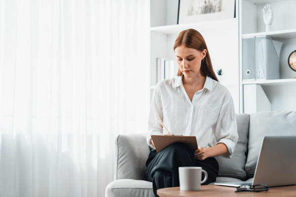Psychologist woman in clinic office professional portrait with friendly smile feeling inviting for patient to visit the psychologist. The experienced and confident psychologist is utmost specialist