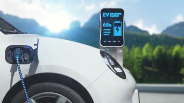 Elektrikli araba, dağ arka planındaki çevre dostu enerji şarj istasyonunun fütüristik akıllı EV şarj cihazıyla şarj oluyor. Sürdürülebilir doğa ve EV arabalı seyahat konsepti. İnceleyin