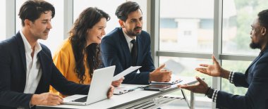 Diversity recruiters interview candidate at the bright office. A group of human resources professionals explaining an applicant for a new position. asking interviewee a question. Intellectual. clipart