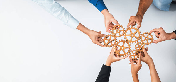Top panorama banner of business team joining cogwheel in circular together symbolize successful group of business partnership and collective teamwork in workplace with productive efficiency. Prudent