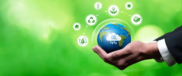 Businessmans hand holding Earth globe symbolize corporate commitment to ESG or CSR to reduce carbon emission and adopting eco-friendly clean business minimizing environmental impact.Panorama Reliance