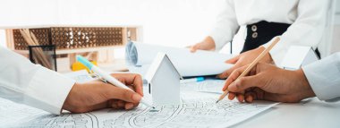 Worker, architect and engineer work on real estate construction project oratory planning with cartography and cadastral map of urban town area to guide to construction developer business plan of city clipart