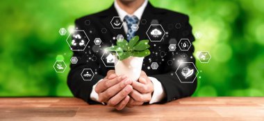 Çevresel tasarım ikonuna sahip yeşil santral sahibi iş adamı, temiz ve sürdürülebilir enerji kullanarak karbon emisyonunu azaltmaya yönelik ESG kararlılığıyla çevre dostu işi sembolize ediyor. Boşluk