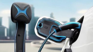 Elektrikli araba şarj istasyonuna bağlanır ve şehrin arka planında gelişmiş EV şarj cihazıyla şarj edilir. Gelecekteki yenilikçi çevre dostu enerji sürdürülebilirliği CO2 emisyonunu azaltmak için. İnceleyin