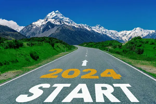 2024 New Year road trip travel and future vision concept . Nature landscape with highway road leading forward to happy new year celebration in the beginning of 2024 for bliss and successful start .