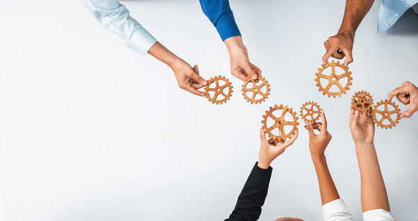 Top panorama banner of business team joining cogwheel in circular together symbolize successful group of business partnership and collective teamwork in workplace with productive efficiency. Prudent