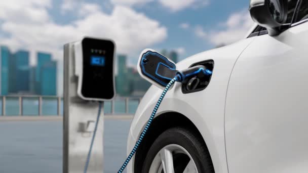 充電ステーションが付いている電気自動車のプラグは都市の背景の事前Ev充電器によってスマートな電池を充電します 二酸化炭素排出量を削減するための革新的な環境に優しいエネルギーの持続可能性 パーセント — ストック動画
