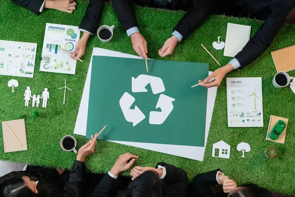 Top view panorama banner recycle icon on meeting table in office with business people planning eco business investment on waste management as recycle reduce reuse concept for clean ecosystem. Quaint