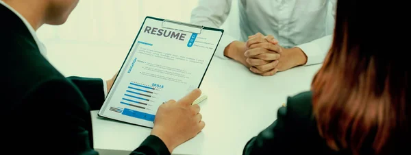 Candidate in job interview with human resources manager at office desk having oratory conversation for search person to fill vacant hiring position . Professional HR specialist interview candidate .