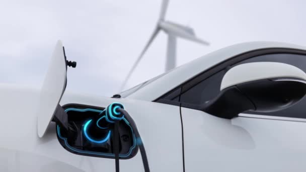 在具有自然室外背景的风力涡轮机场 采用智能电动汽车充电器从充电站充电站充电 替代清洁可持续能源的技术进步 仔细阅读 — 图库视频影像