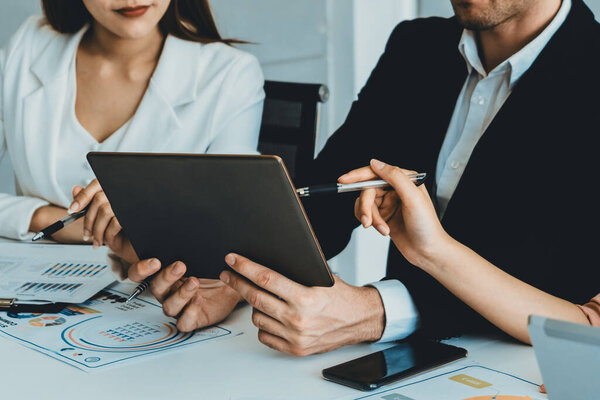 Businessman is in meeting discussion with colleague businesswomen in modern workplace office. People corporate business team concept. uds