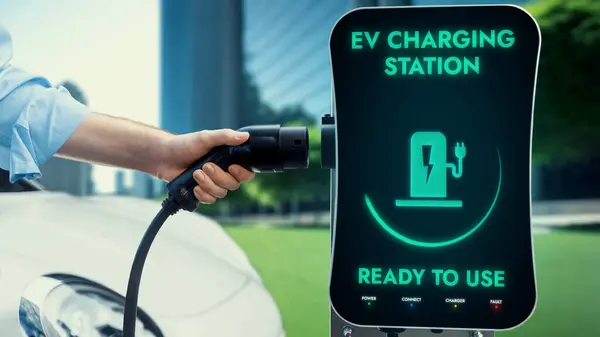 Businessman Pull Charger Recharge His Electric Cars Battery Charging Station — Stock Photo, Image