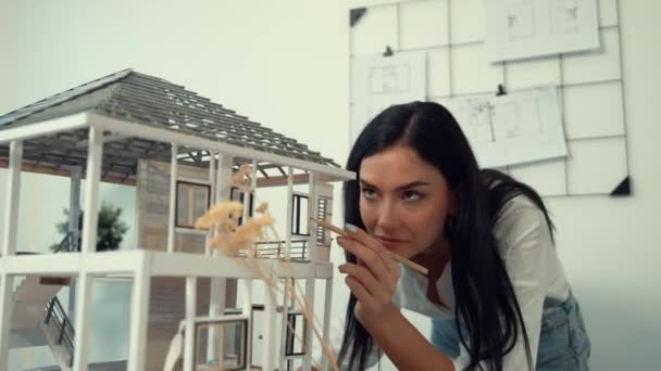 Closeup Young Beautiful Smart Engineer Focus Measuring House Model Using — Stock Video