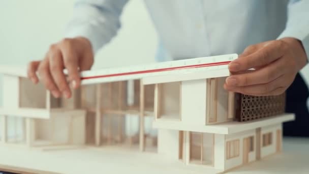 Professional Male Architect Using Ruler Measure House Model Length While — Stock Video