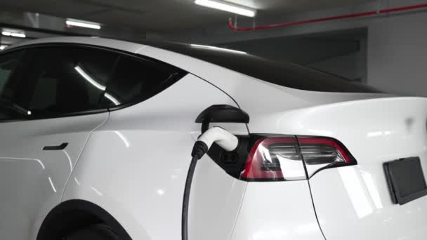 Slow Motion Electric Car Recharge Shopping Center Indoor Parking Lot — Stock Video