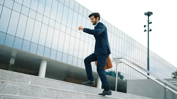 Successful business man celebrate increasing sales while standing. Happy project manager or leader proud with successful project, getting a promotion, getting a job. Overjoy and happy. Exultant.