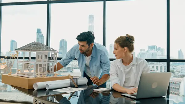 Smart Architect Engineer Inspect House Model While Colleague Using Laptop — Stock Photo, Image