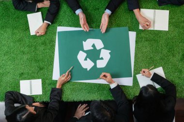 Top view panorama banner recycle icon on meeting table in office with business people planning eco business investment on waste management as recycle reduce reuse concept for clean ecosystem. Quaint clipart