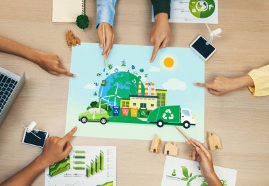 Green city and waste management poster was placed on meeting table during a green business meeting discussion. ESG environment social governance and Eco conservative concept. Top view. Delineation. clipart