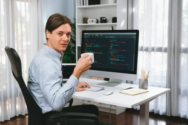 Developer Looking Camera Holding Coffee Cup Online Software Laptop Monitor — Stock Photo, Image