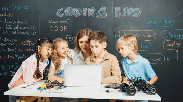 Diverse Student Writing Engineering Code While Boy Fixing Mother Board — Stock Photo, Image