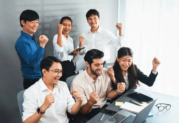 Excited and happy office worker employee celebrate after make successful strategic business marketing planning. Teamwork and positive attitude create productive and supportive workplace. Prudent