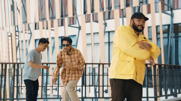 stock image Hip hop team dance break dance while multicultural friend surrounded and clapping hands to cheer or encourage his friend to dance. Active and energetic street dance. Outdoor sport 2024. Endeavor.