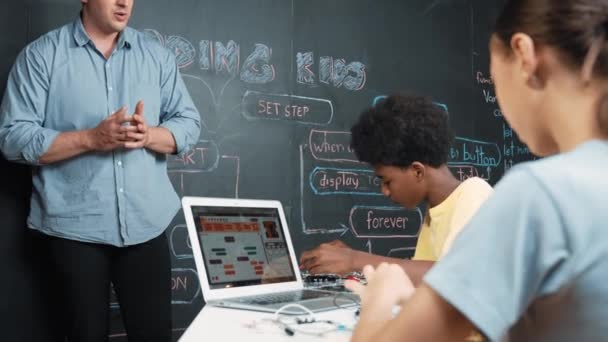 Teacher Teaching Coding System While Diverse Academic Student Fixing Main — Stock Video