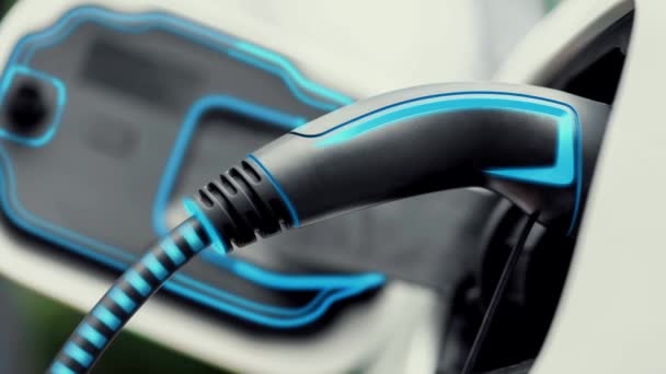 闭塞式电动汽车充电器插在电动汽车上 用发光光缆从充电站充电 尖端创新和未来绿色能源可持续性 仔细阅读 — 图库视频影像