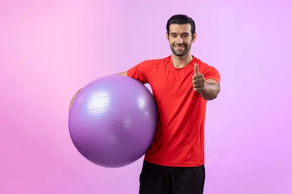 Full body length gaiety shot athletic and sporty young man with fitness exercising ball in standing posture on isolated background. Healthy active and body care lifestyle.