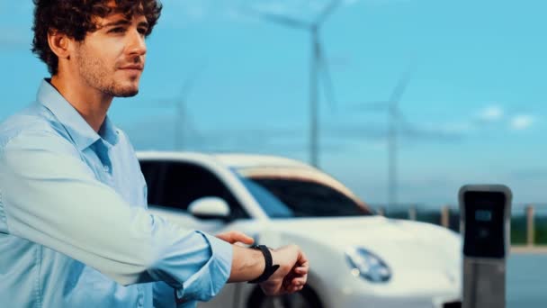 Businessman Checking Smartwatch Display Digital Cars Battery Status Hologram Recharging — Stock Video