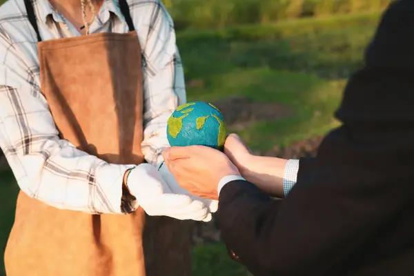 Eco-business company empower farmer with eco-friendly farming practice and clean agricultural technology. Cultivate sustainable future and holding Earth globe symbolize commitment to environment.Gyre