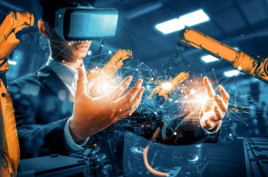 Mekanize endüstriyel robot kol kontrolü için XAI Gelecek VR teknolojisi. Sanayi devrimi ve otomatikleştirilmiş üretim süreci için robot teknolojisi kavramı.